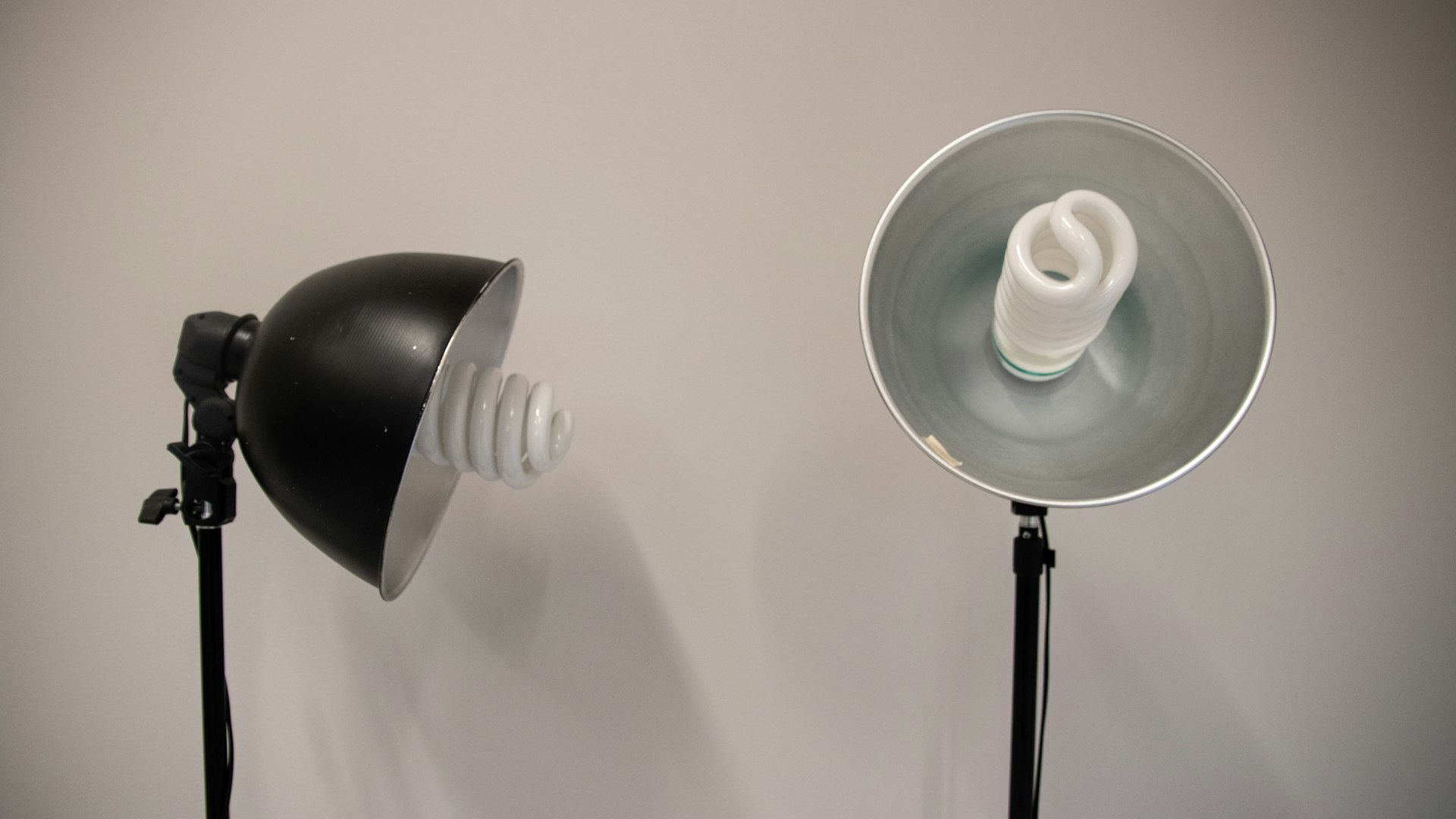 Symmetrical studio light stands set up for a commercial product photography shoot
