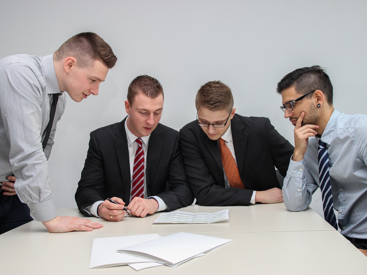 B2B sales team reviewing a company profile document together