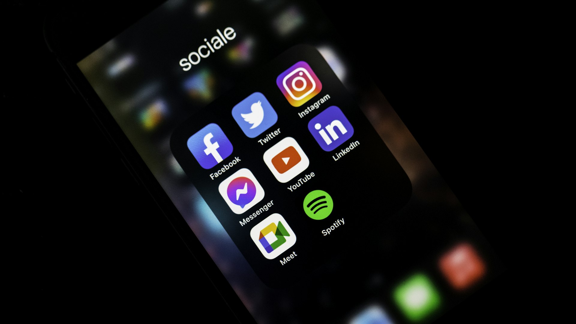 Social media feeds on mobile devices representing paid social reach